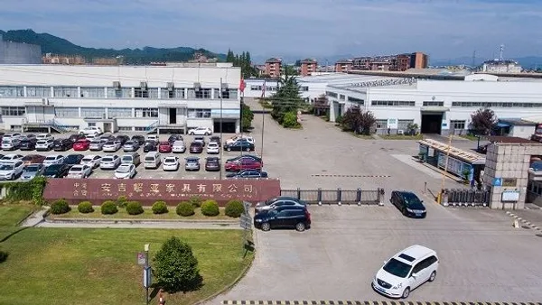Wider aerial photo of the Anji Chaoya Furniture campus showing workshops, warehouses and the parking area